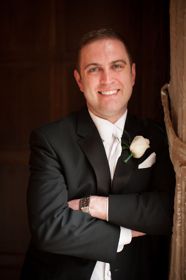 the groom wearing a white tie