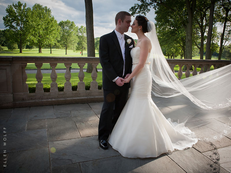 bride and groom at Muttontown Club overlooking the golf course