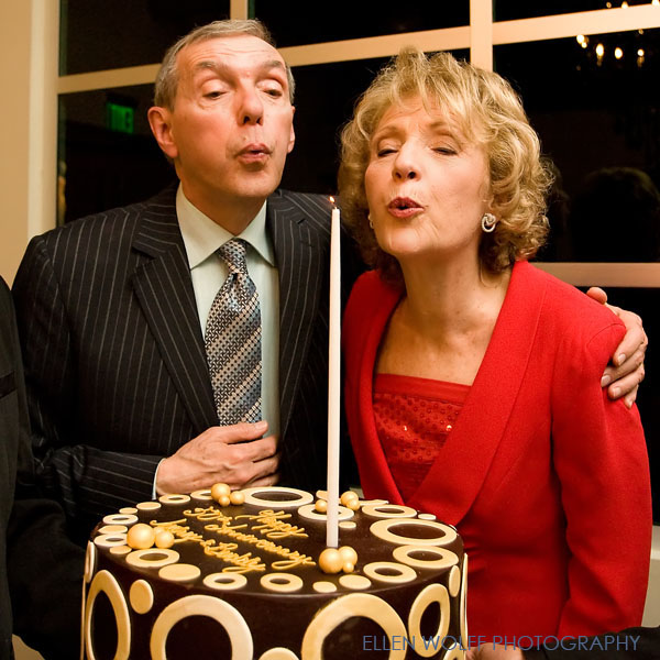 blowing out the candle on the anniversary cake