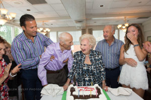 100 and 103 years old celebrating with the birthday cake